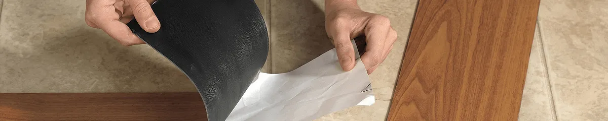A professional installing vinyl flooring in Rochester, NY
